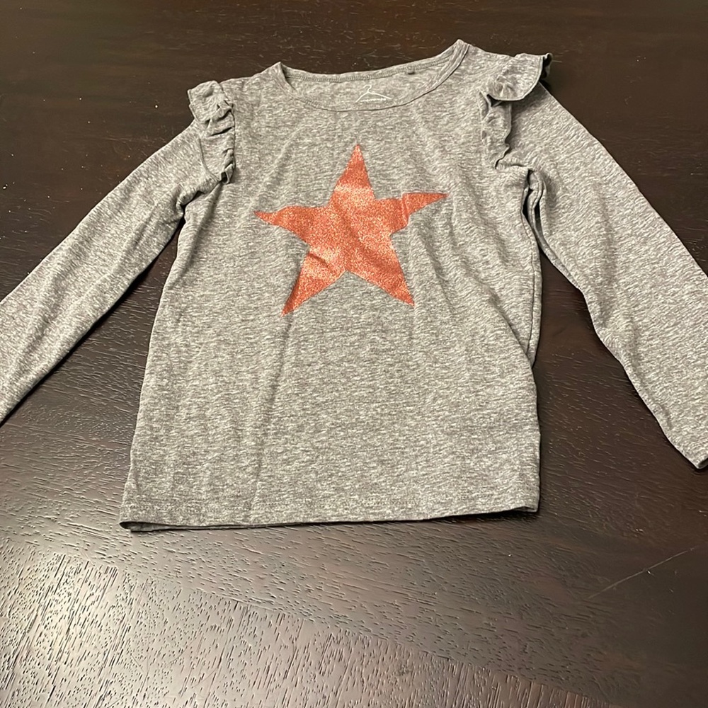 Comfy long sleeve with a shiny star. Almost new.